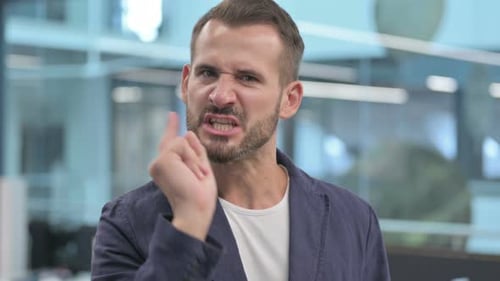 Upset Man Pointing and Expressing Disagreement