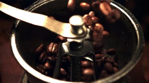 Super Slow Motion of Coffee Beans Fall Into the Coffee Grinder