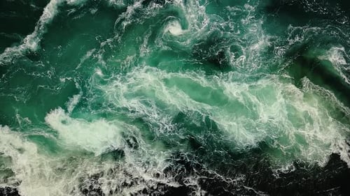 Waves of Water of the River and the Sea Meet Each Other During High Tide and Low Tide