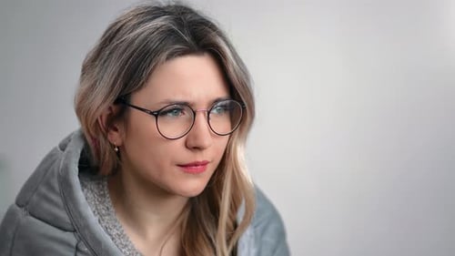 Woman Coughing with Cold, Wearing Blanket Indoors