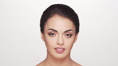 Studio portrait of young and beautiful brunette woman over