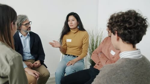 Adults Talking in Support Group Meeting