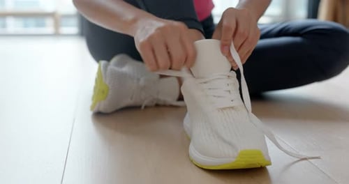 Woman wear sport shoes and prepare for running