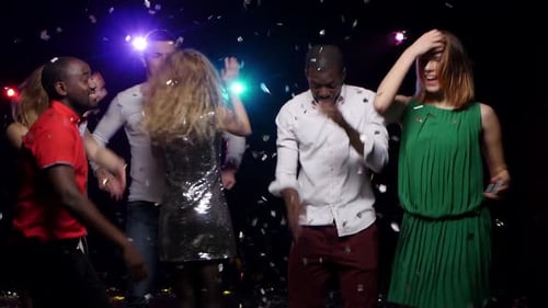 Happy Friends Celebrating with Confetti at Party