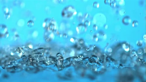 Water Droplets Falling on Cool Blue Surface