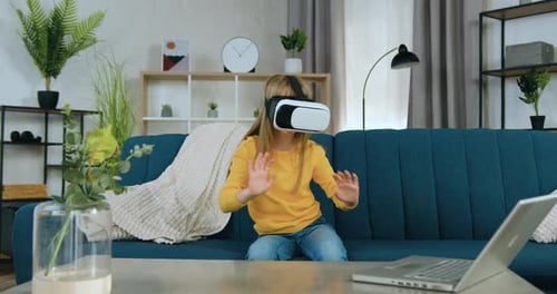 Child Experiencing Virtual Reality with VR Headset at Home