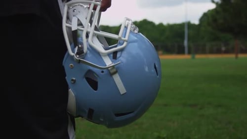 Close Up of American Football Helmet on Field