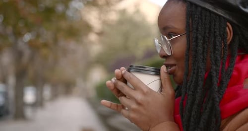 Attractive Black Girl with Coffee Go on the Street