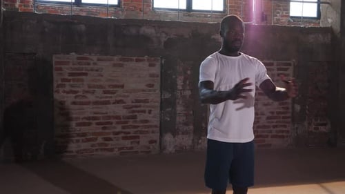 Exercise. Fit man warming up before fitness workout at gym