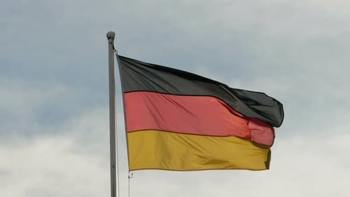 German Flag Waving in the Wind on Cloudy Day
