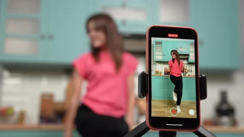 Woman Dancing, Filming on Smartphone in Kitchen