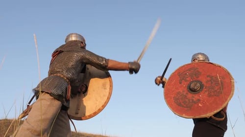 Two Men Fighting in Medieval Battle with Swords