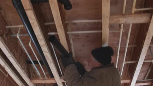 Plumber Glue White Pipe a Mount New Plastic Drain Under a Construction