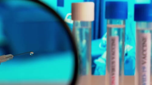 Vaccine Syringe and Vials in Medical Setting