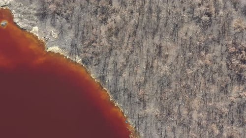 Above red acidic mine drainage waters 4K aerial video