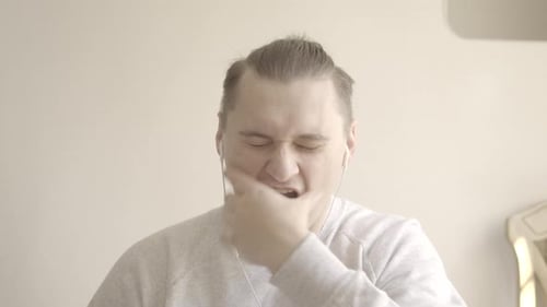 Brunette Caucasian Man Yawning As Listening To Colleagues in Online Video Chat. Portrait of Handsome