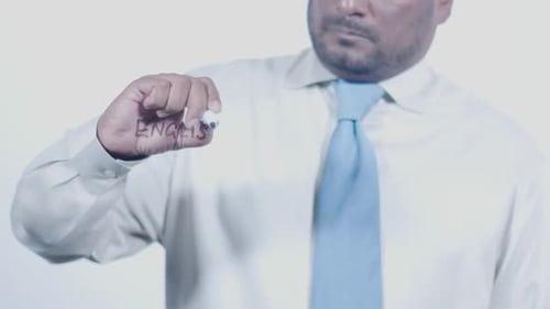 Man Writing English on Clear Surface with Marker