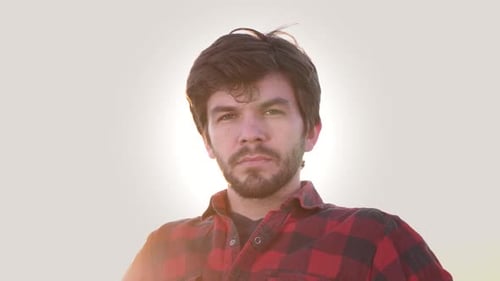Portrait of a bearded man wearing a flannel shirt