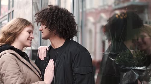 Passionate Young Couple Kissing And Embracing Spinning Around Outdoor In The City