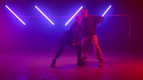 Professional Dancers Performing Street Style on Nightclub