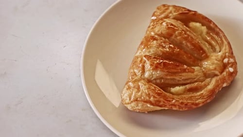 Delicious Golden Brown Pastry on a White Plate