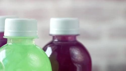 Three Bottles of Colorful Healthy Drinks