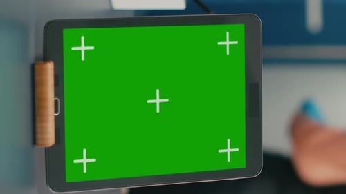 Vertical Video Close Up of Tablet Computer with Mock Up Green Screen Chroma Key Display