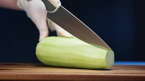 Peeled Zucchini Sliced on a Wooden Cutting Board