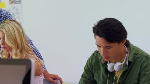 Young Adults Collaborating in Office Workplace