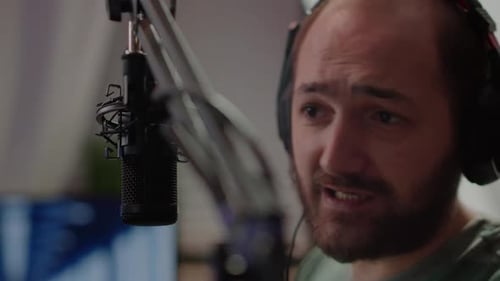 Close Up of Pro Streamer Discussing with Players at Professional Micorphone