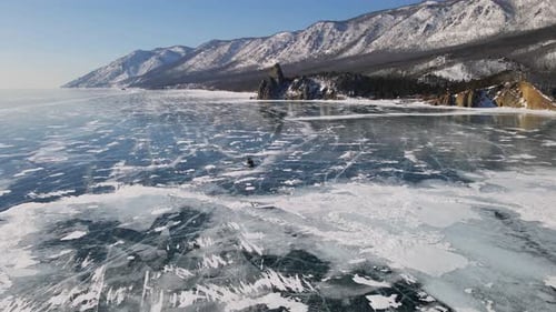 Hovercraft Gliding on Beautiful Frozen Ice Surface of Baikal Lake in Winter in Russia