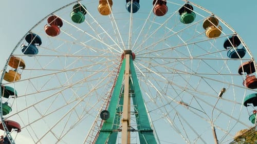 View of a ferris wheel over blue sky. Good weather