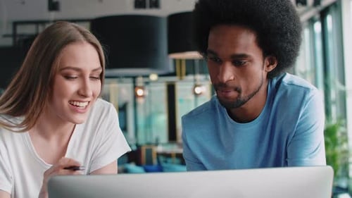 Young couple working with technology in the office