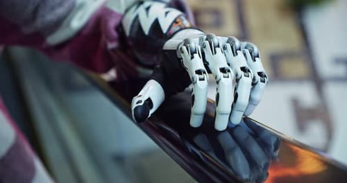 Close Up of Futuristic Robotic Arm on Railing