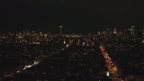 Forwards Fly Above Metropolis at Night