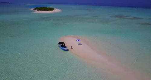 Wide overhead travel shot of a summer white paradise sand beach and turquoise sea background