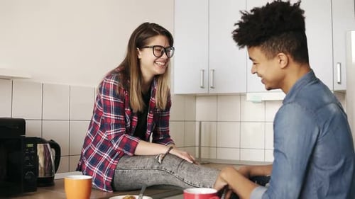 Friends Chatting at Kitchen Counter at Daytime