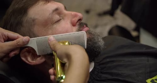 Man Getting a Beard Trim at Barber Shop