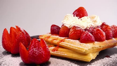 Delectable Waffles with Strawberries and Whipped Cream