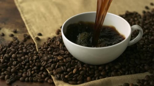 Pouring coffee into cup, Slow Motion