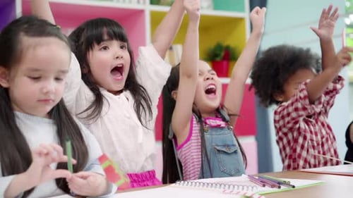 Enthusiastic Children Drawing Together in Classroom