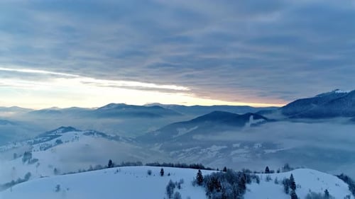 Aerial View in Foggy Sunset Winter Mountain