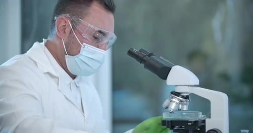 Scientist Using Microscope in Modern Laboratory