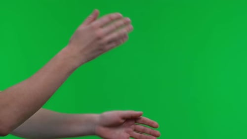 Close Up Female Hands Shakes Off on Isolated Green Background