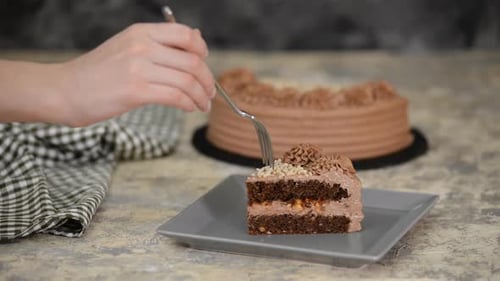 Delicious Chocolate Cake Slice Being Served with Fork