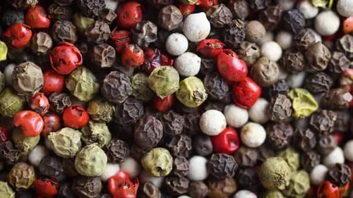 Black Red White Green And Allspice Mix Peppercorn Background
