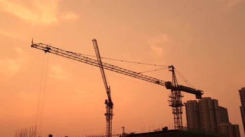 Construction Material Shadow Of Tower Crane In Sunset