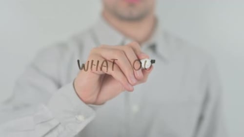 Man Writes on a Clear Surface
