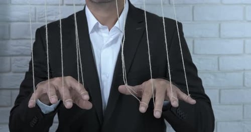 Puppet Master Controlling Strings