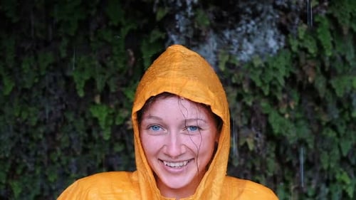 Woman in Rain Jacket Smiling in the Rain